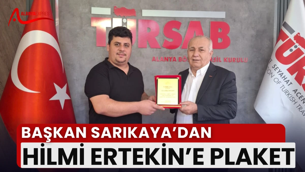 SARIKAYA’DAN ERTEKİN’E “EMEK VE SADAKAT” PLAKETİ!